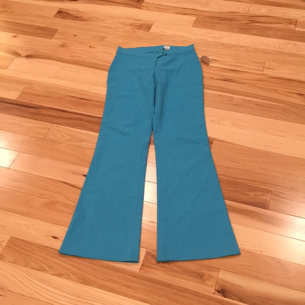 Teal colored dress pants.